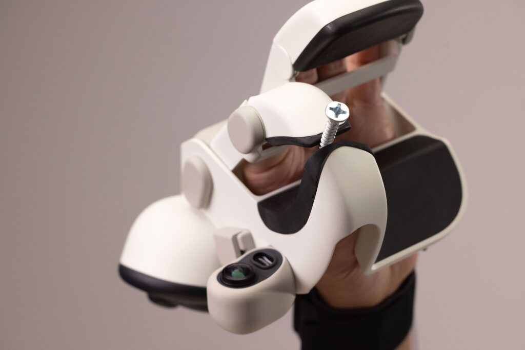 Close up of Memo robot hand precisely handling a screw showing advanced precision in manipulation